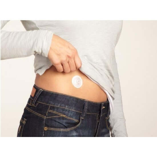 Person demonstrating use of i-Port Advance™ insulin administration port on the abdomen for comfortable daily diabetes care.