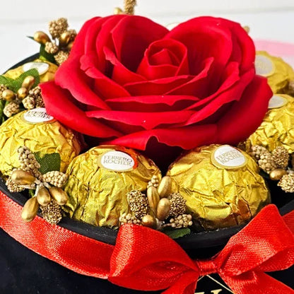 FLORAL ARRANGEMENT WITH A SOAP ROSE, GOLD STAMEN AND 8 Ferrero Rocher, BLACK VELVET BOX, RED