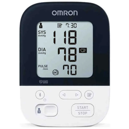 Omron M4 Intelli IT digital blood pressure monitor display showing SYS, DIA, and pulse readings.